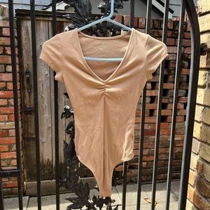 Tan v-neck short sleeve bodysuit